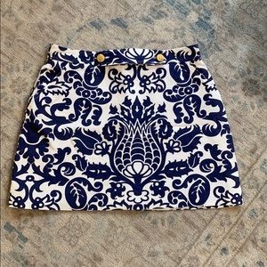 Patterned skirt with gold buttons